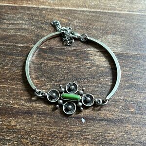 Silver bracelet with green bead